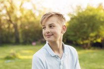 Portrait of teenage blond boy looking away — Stock Photo