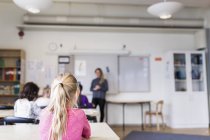 Girls learning in classroom — Stock Photo