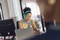 Woman wearing headphones — Stock Photo