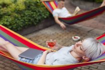 Couple relaxing on hammocks during daytime — Stock Photo