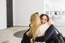 Young women hugging each other — Stock Photo