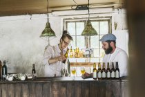 Two men drinking beer in local brewery — Stock Photo