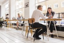 People working in cafe indoors — Stock Photo