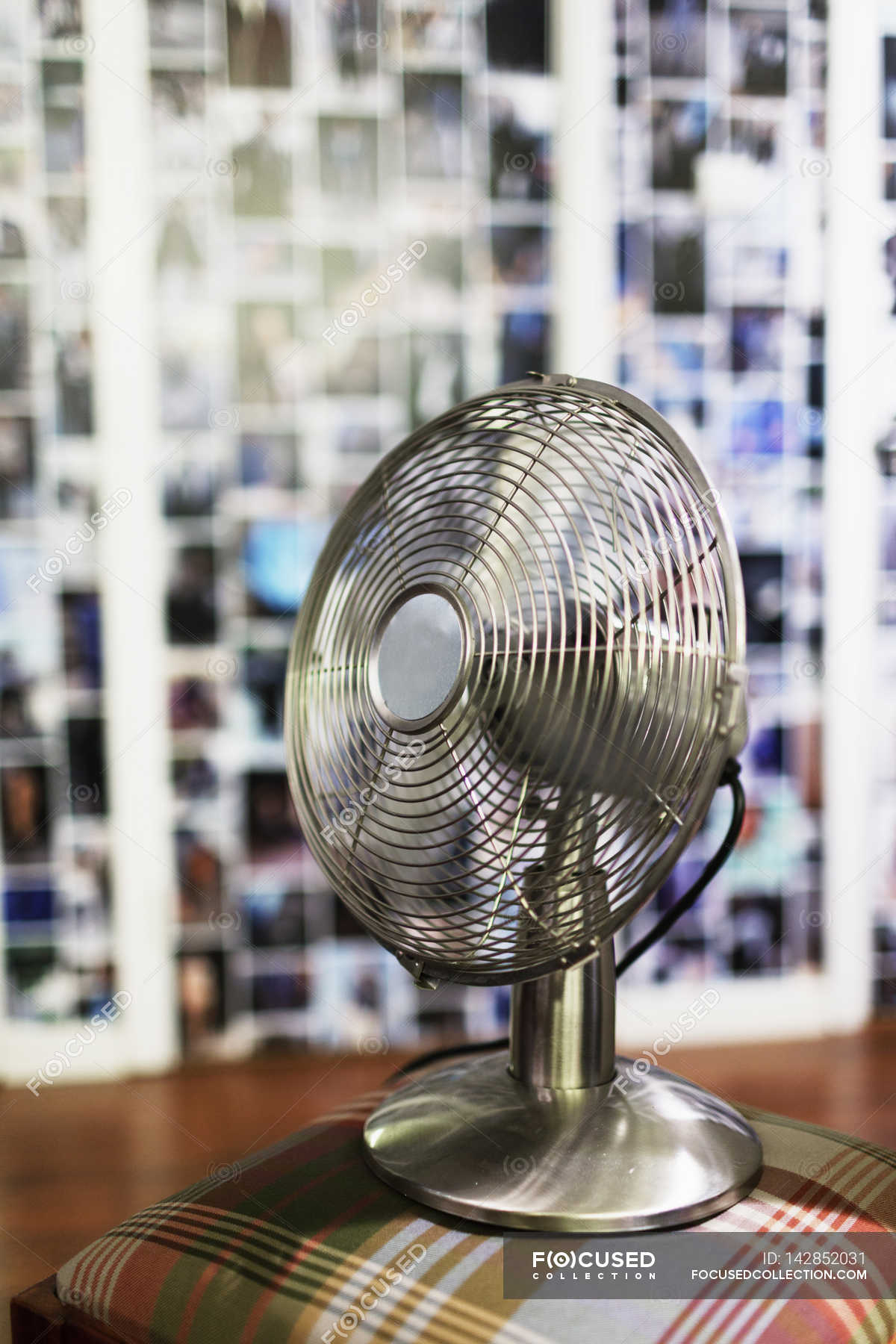 Electric fan on stool — store, indoors Stock Photo 142852031