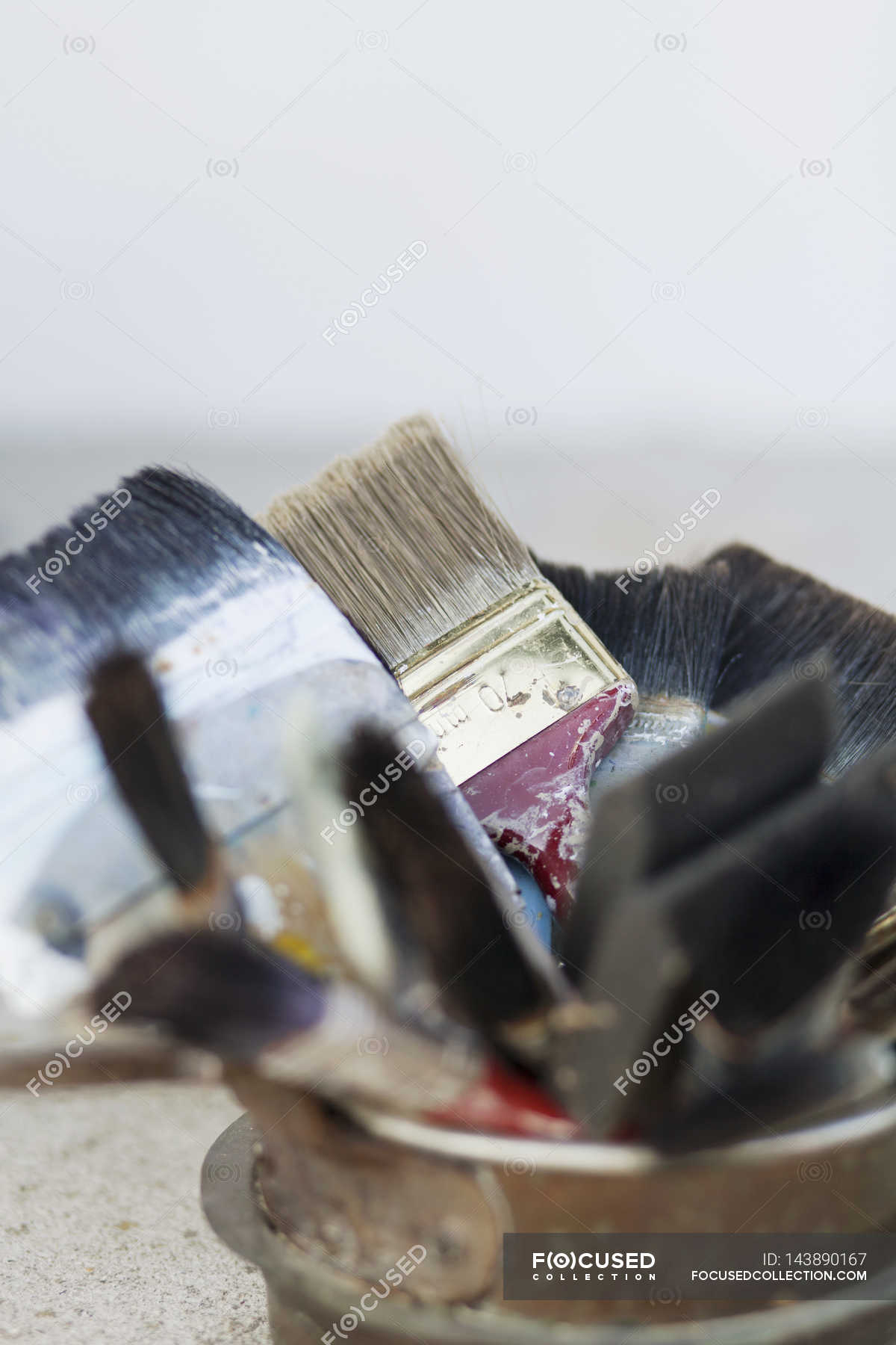 Paint brushes in container — variation, interior Stock Photo 143890167