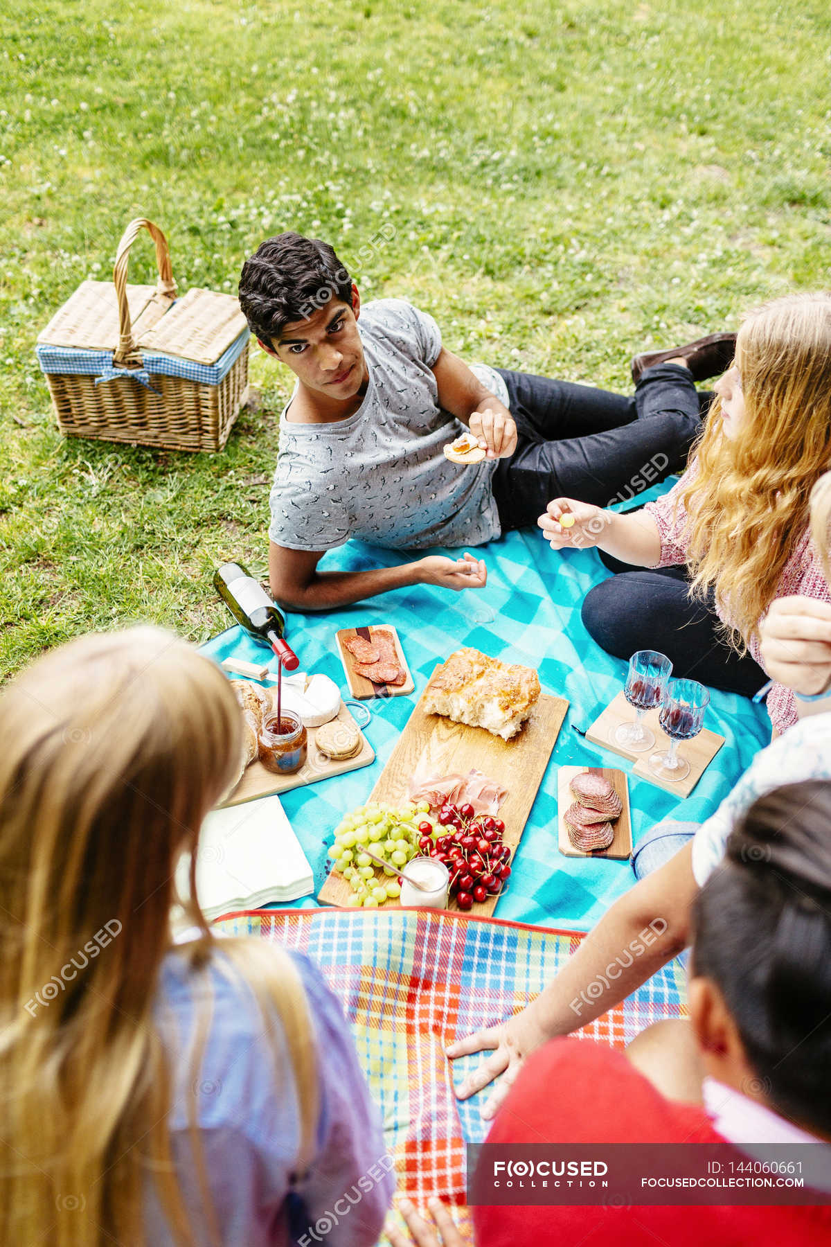 Friends hanging out, enjoying picnic - Stock Image - F020/2364 - Science  Photo Library