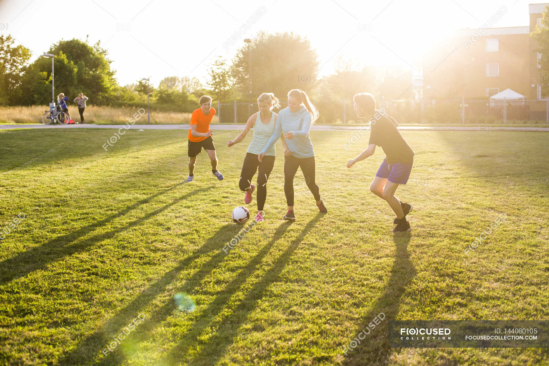 friends playing soccer