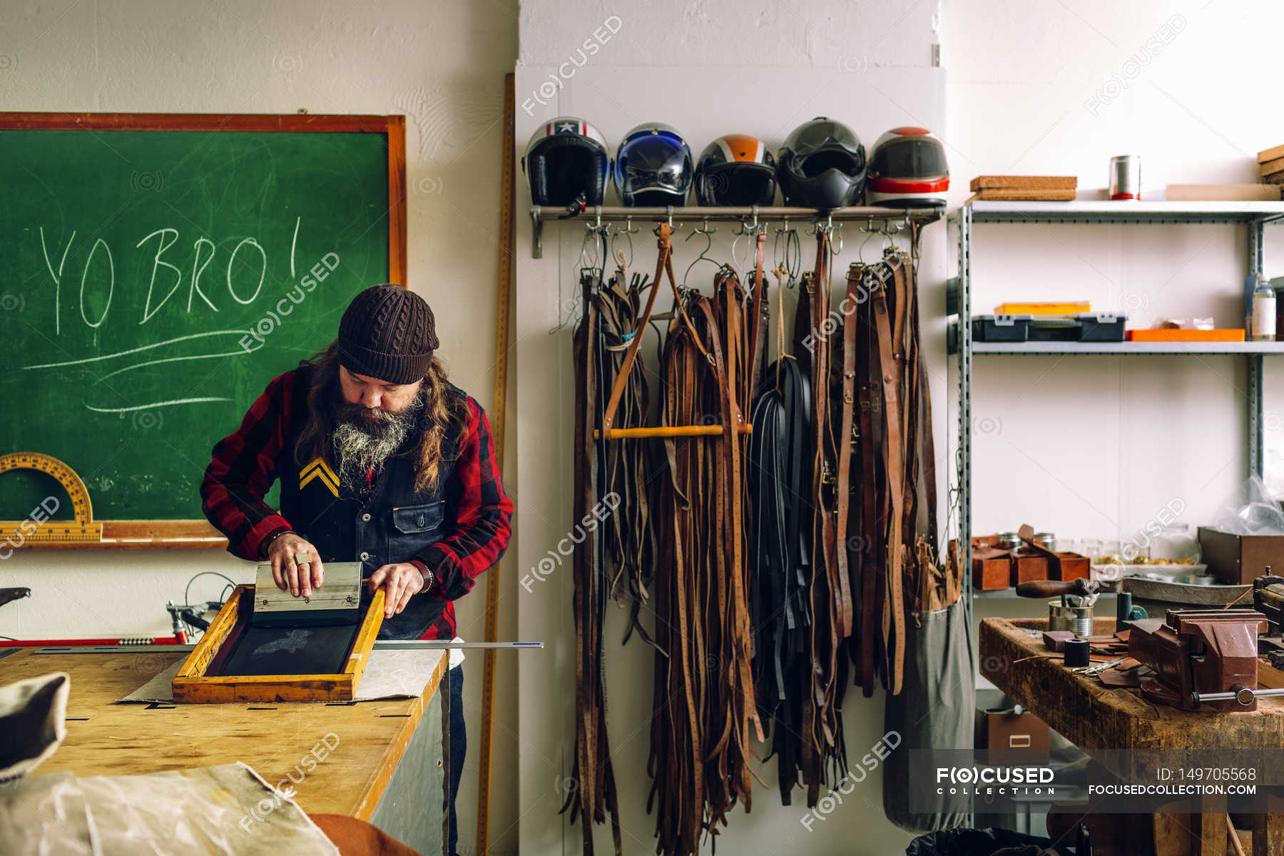 Worker using squeegee — midsection, workbench Stock Photo 149705568