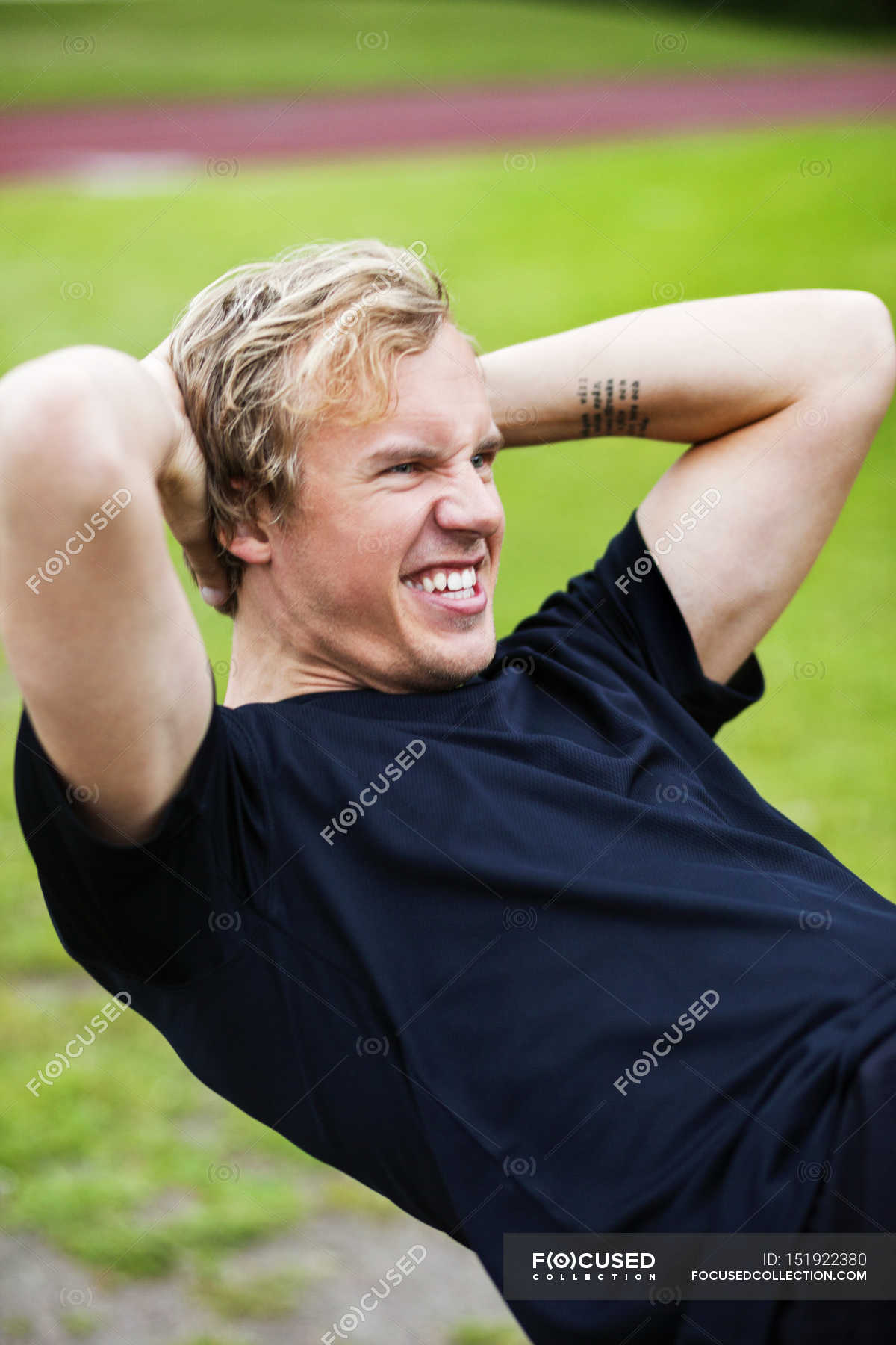 Young man practicing sit-ups — Casual Clothing, sports training - Stock ...