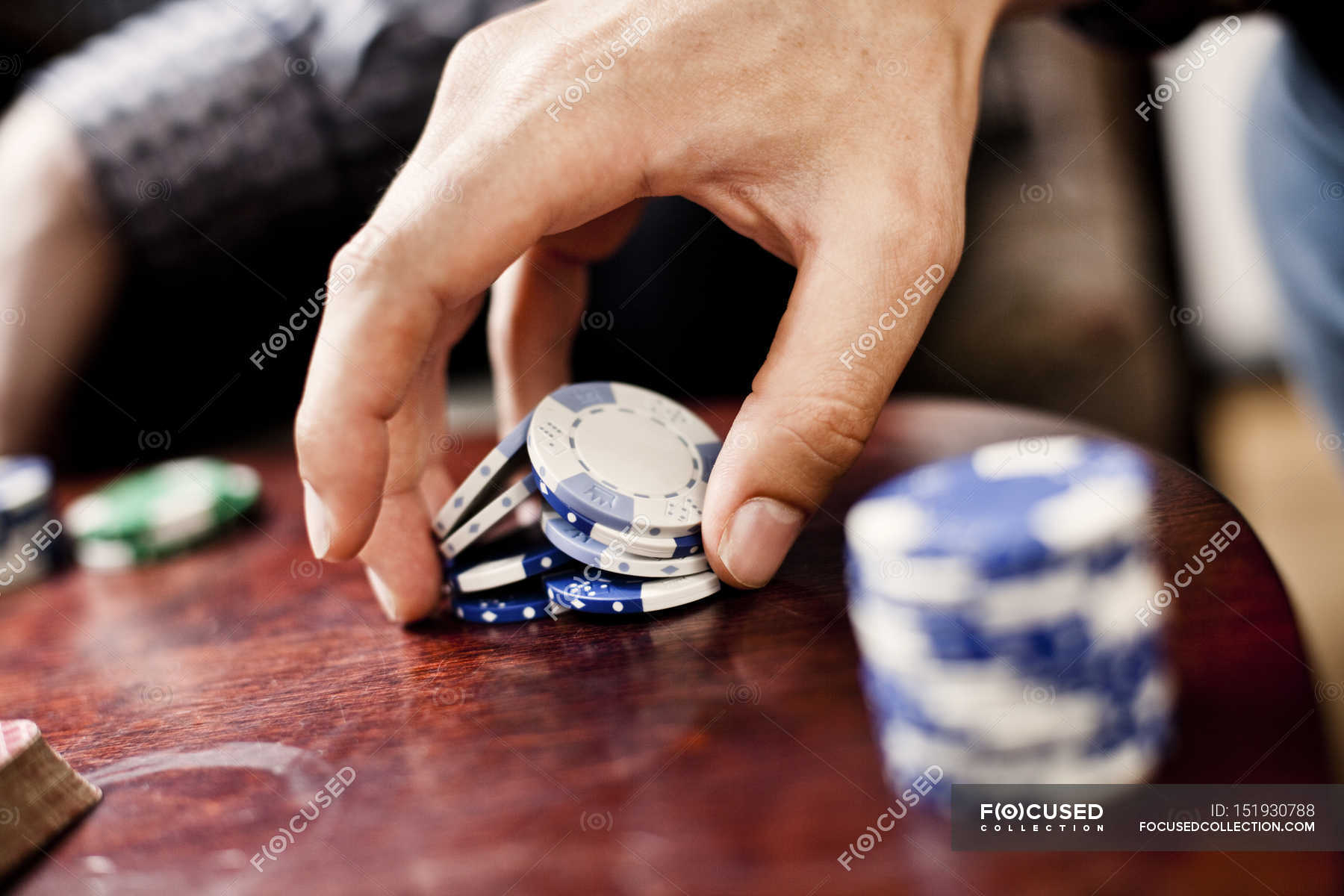 Hand holding poker chips — risk, Arts Culture And Entertainment Stock