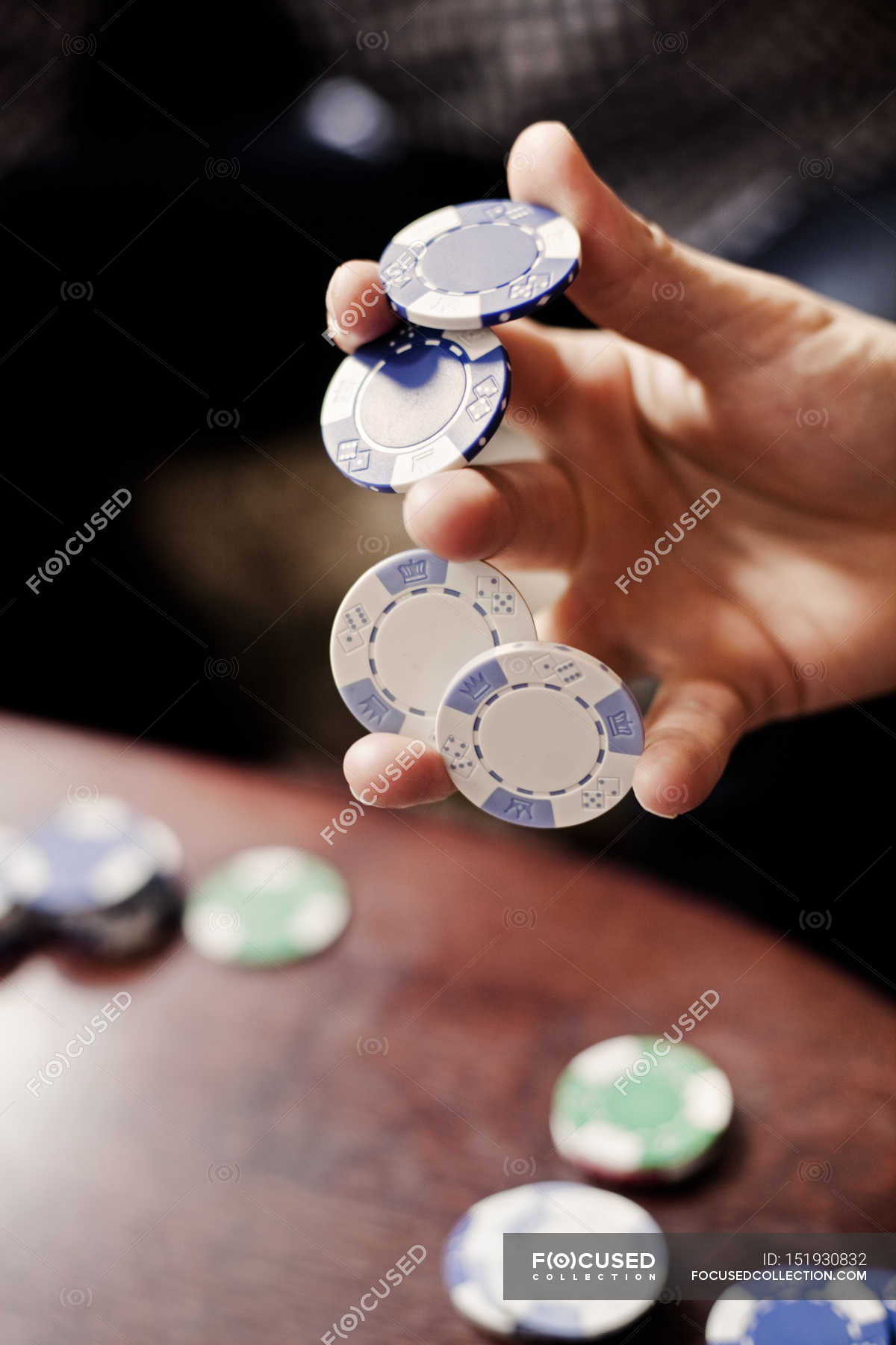 Hand holding poker chips — Enjoyment, Human Body Part Stock Photo