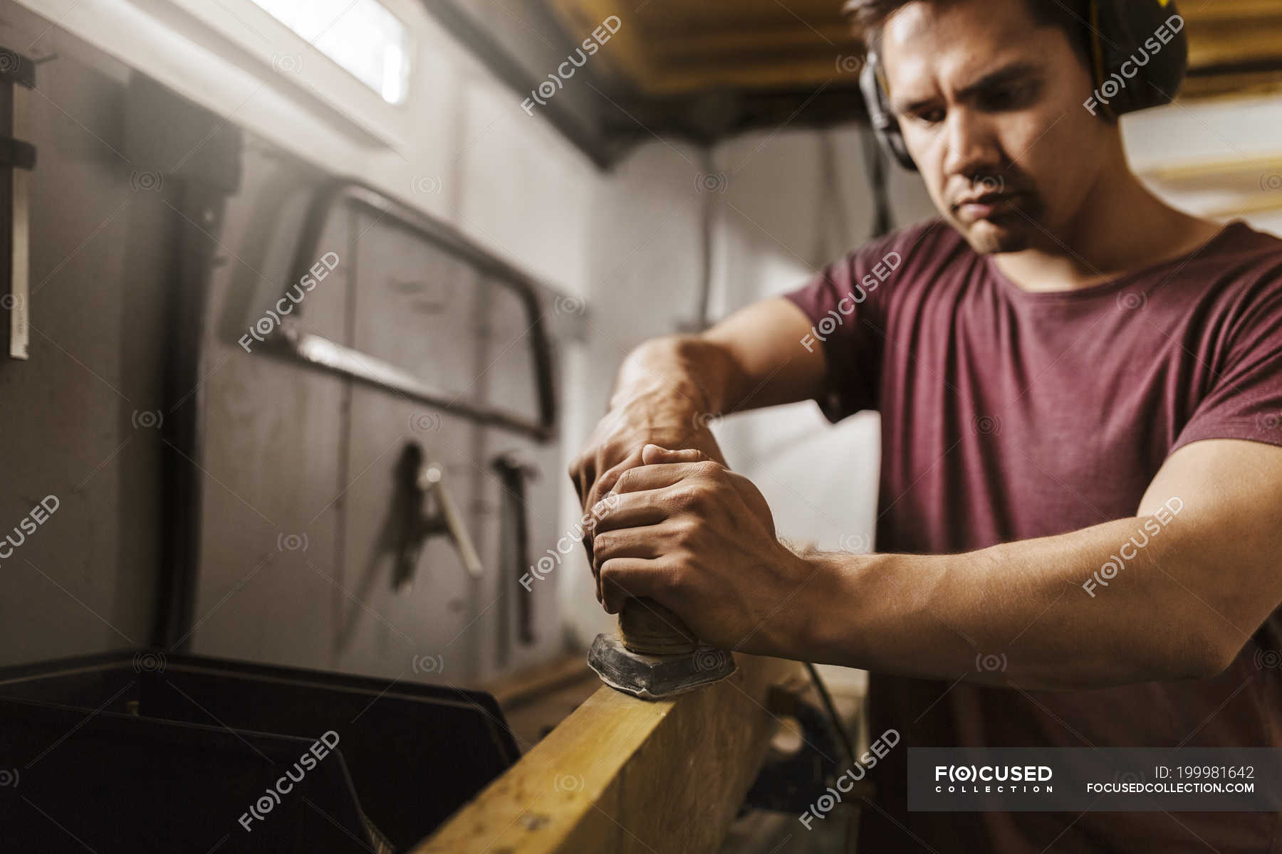 Man polishing wood in garage — indoors, one person - Stock Photo ...