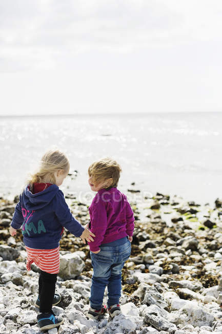 Girls standing at beach — Stock Photo