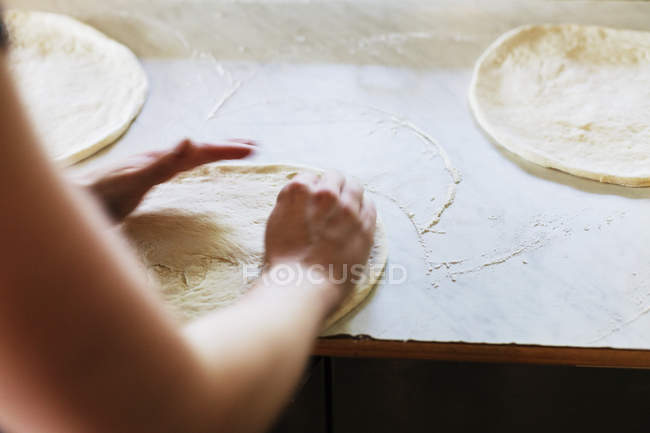 Pizza layers bases on counter — Stock Photo