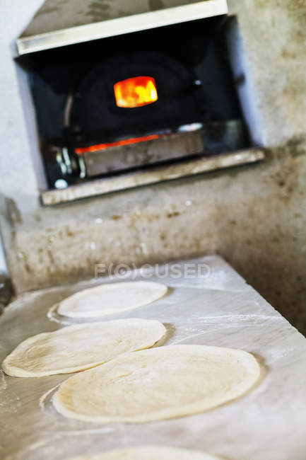 Fresh pizzas layers on counter — Stock Photo