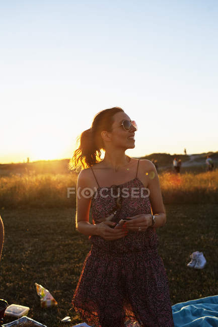 Woman standing on field — Stock Photo
