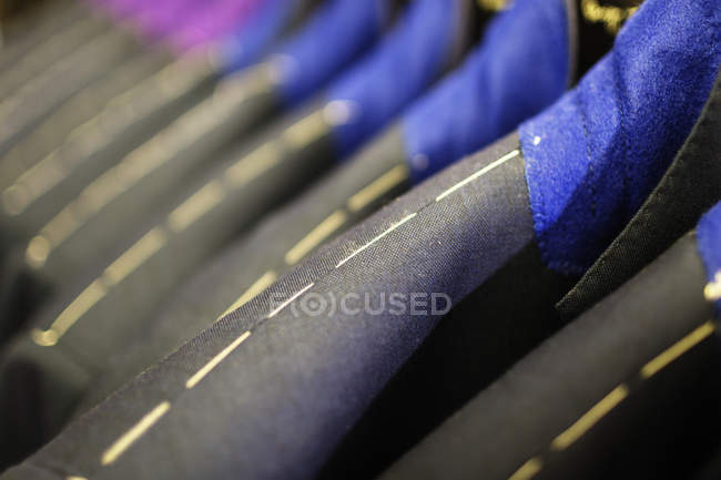 Suits in designer showroom — Stock Photo