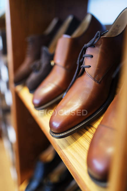 Formal shoes arranged in shelf — Stock Photo