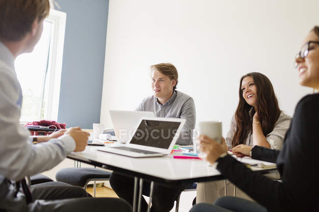 Coworkers discussing in board room — Stock Photo