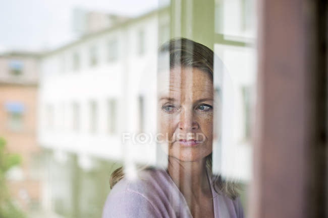 Teacher looking away with reflection — Stock Photo
