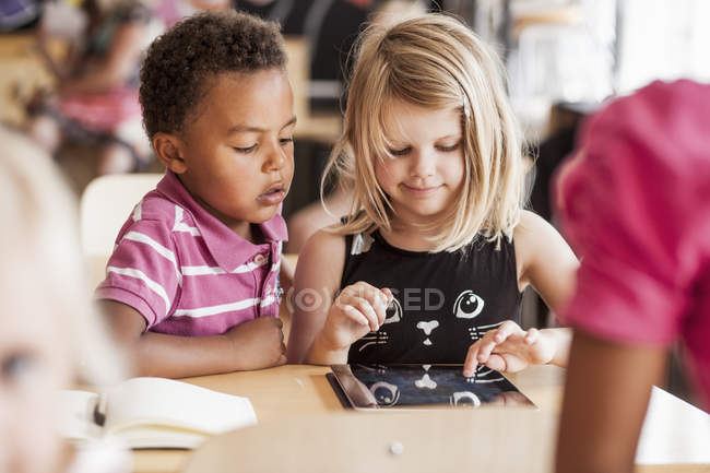 Children using digital tablet — Stock Photo