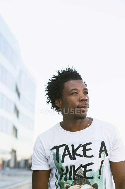 College student against clear sky — Stock Photo