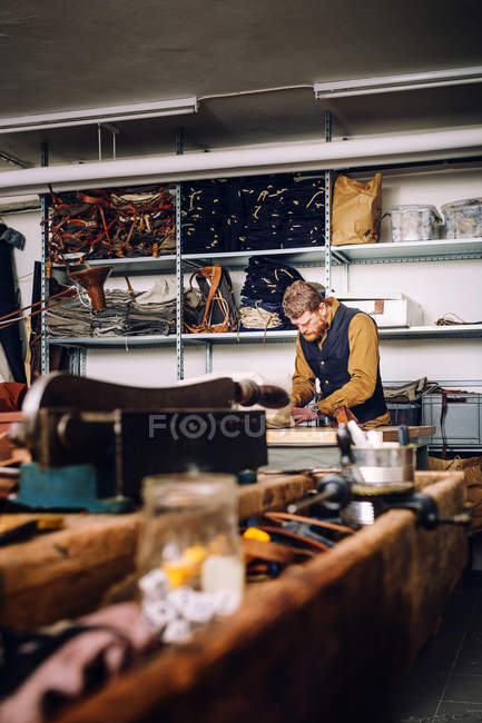 Male worker in bag factory — Stock Photo