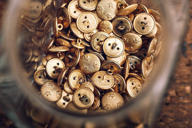 Jar filled with buttons on table — Stock Photo