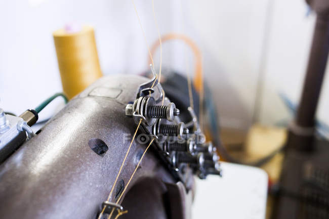 Sewing machine at jeans factory — Stock Photo