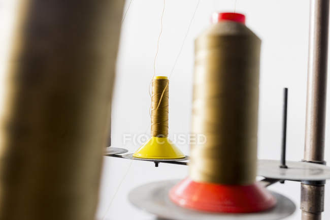 Golden thread spools — Stock Photo