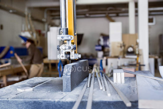 Bandsaw with sticks on table — Stock Photo