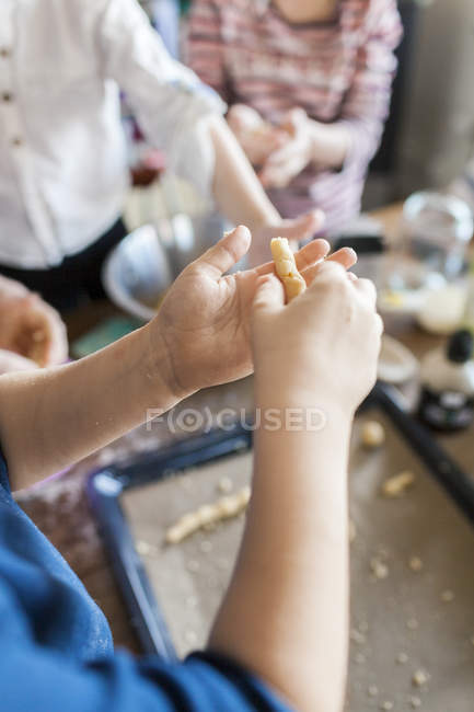 Boy holding dough at home — Stock Photo