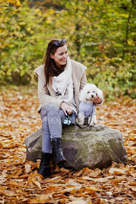 Happy woman with Bichon Frise — Stock Photo