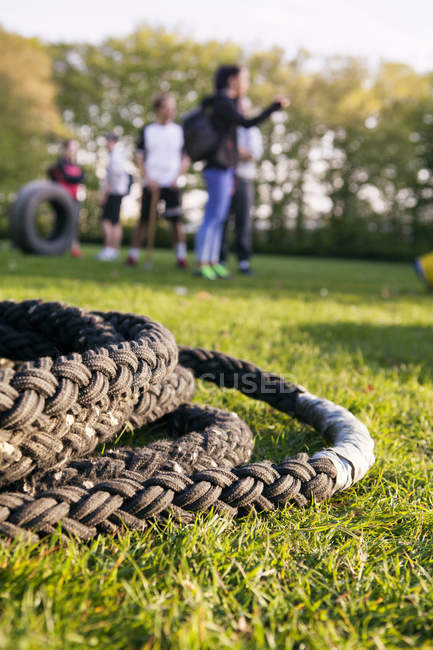 Exercise rope on grassy field — Stock Photo