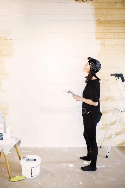 Woman with paintbrush — Stock Photo