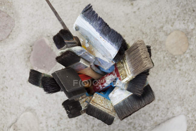 Paint brushes in container — Stock Photo