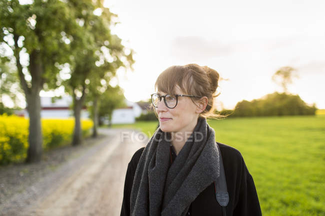 Woman standing at field — Stock Photo