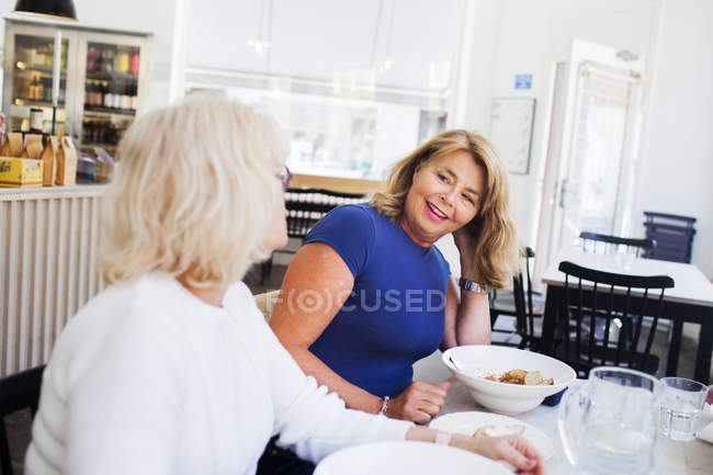 Senior women eating food — Stock Photo
