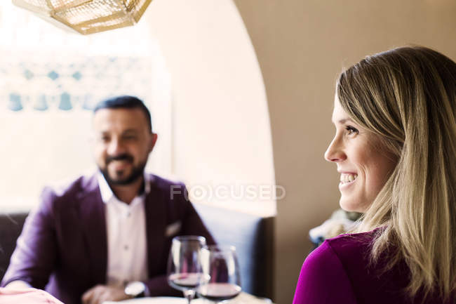Couple sitting at restaurant — Stock Photo