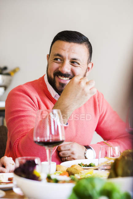 Man sitting at table in restaurant — Stock Photo