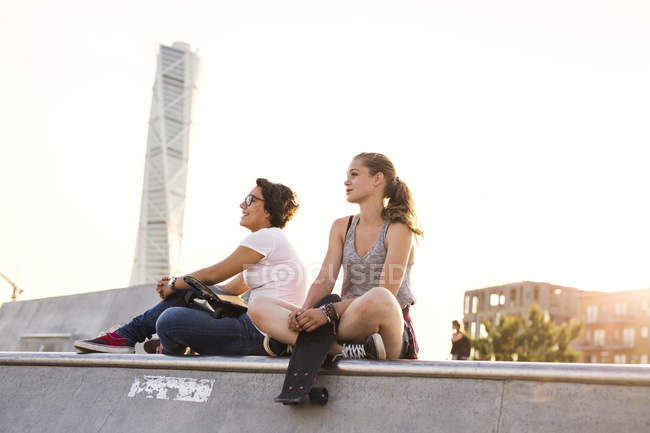 Teenage girls with skateboards — Stock Photo