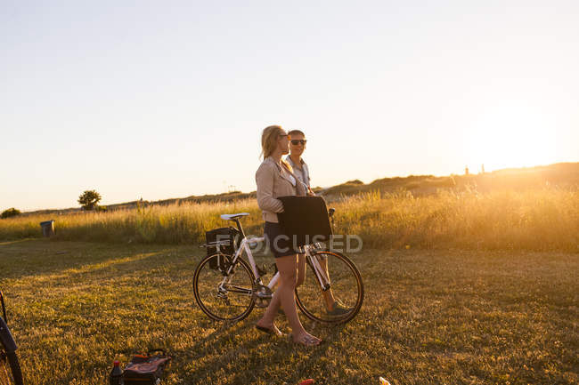Young couple walking at garden — Stock Photo