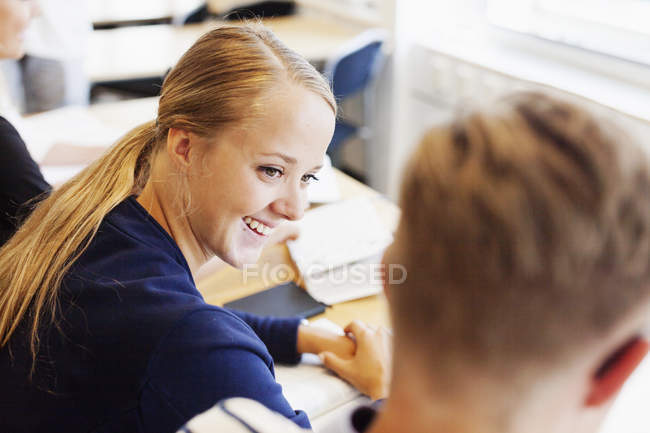 Young students studying in classroom — Stock Photo
