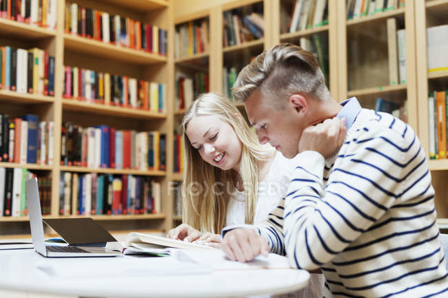 University students studying in library — Stock Photo