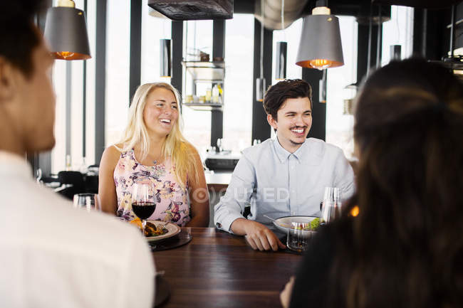 Friends having meal at restaurant — Stock Photo