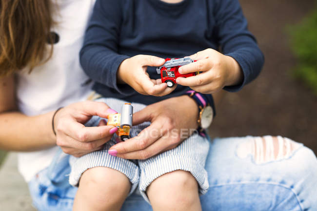 Mother and son playing with toy — Stock Photo