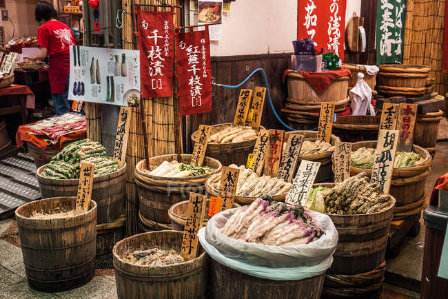 Groceries in barrels in shopping arcade street — Stock Photo