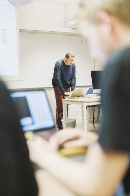 Students and teacher in classroom — Stock Photo