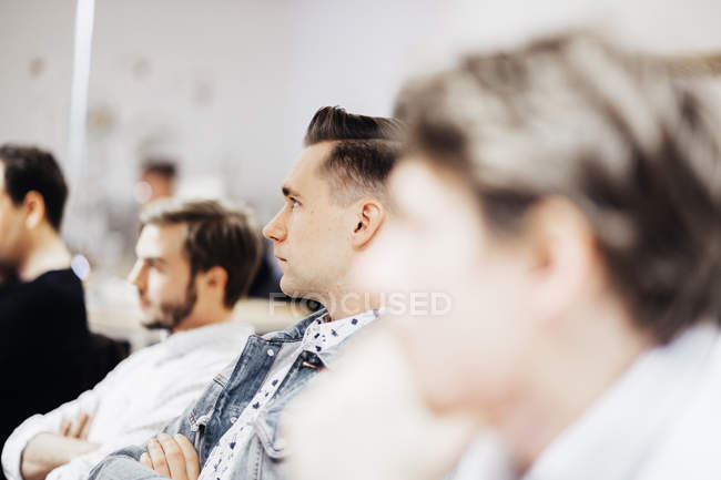 Media students sitting in classroom — Stock Photo