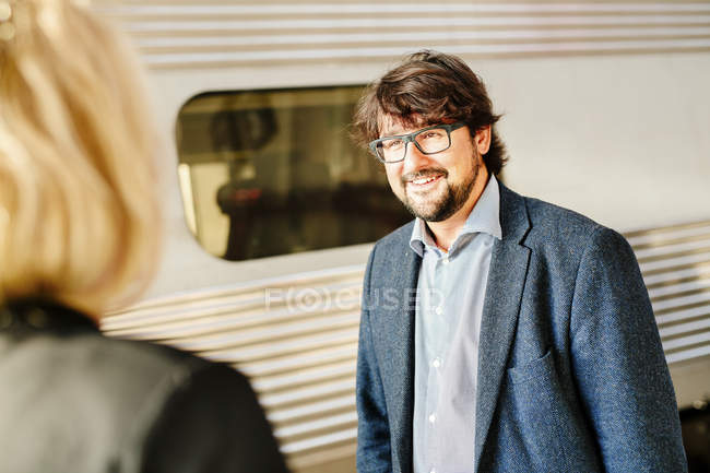 Businessman looking at female colleague — Stock Photo